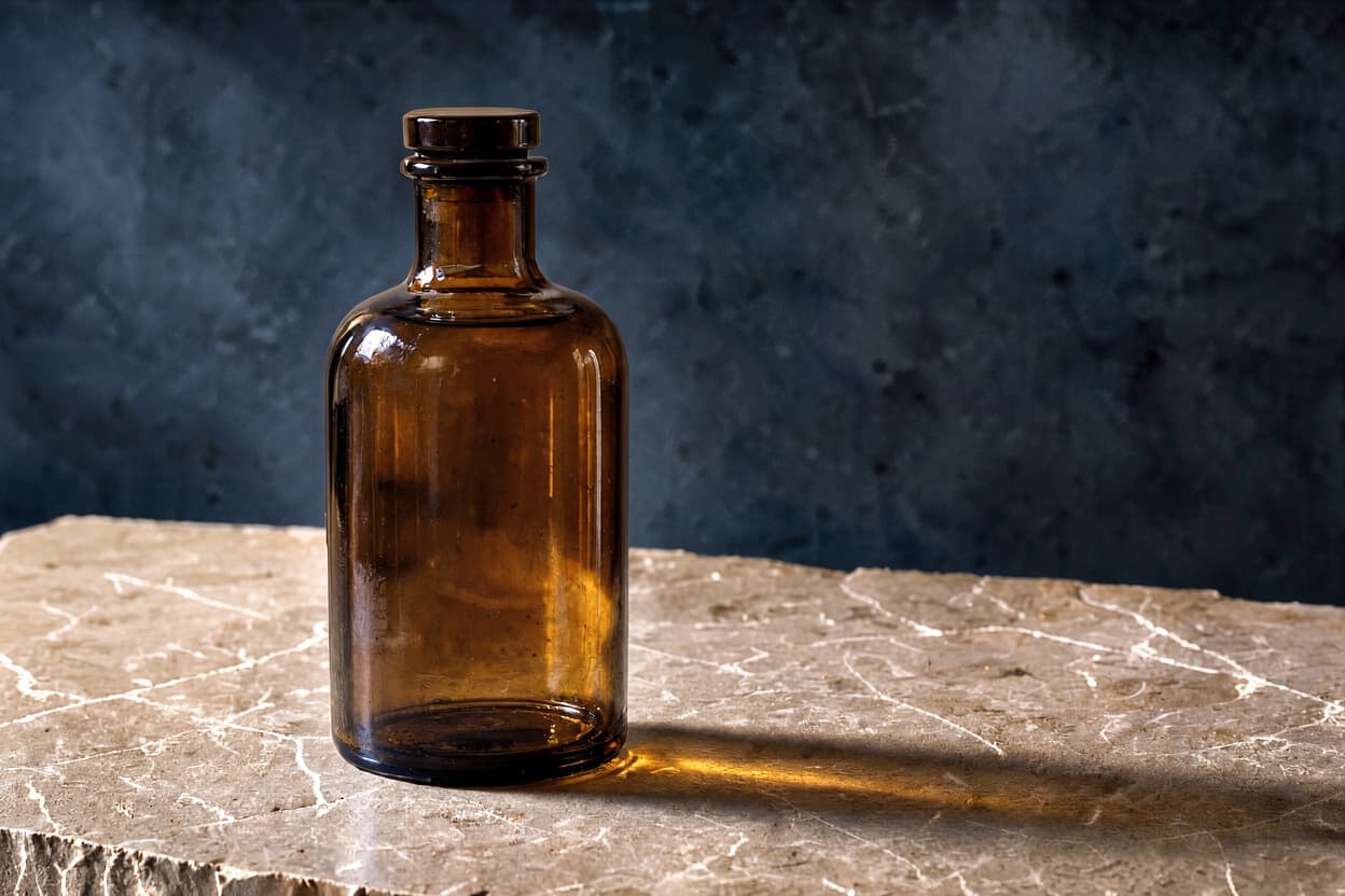 Two-reference result retaining the amber bottle and midnight blue backdrop